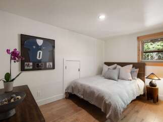 This cozy bedroom features a comfortable bed with plush pillows, perfect for a restful night's sleep.