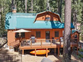 Escape to this charming cabin nestled in a serene forest setting.