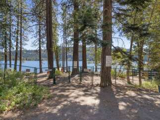 Enjoy exclusive access to this stunning lakefront property, complete with a private pier and beach area.