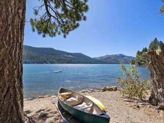 Enjoy serene lakefront living with this stunning property featuring a private canoe ready for your adventures.