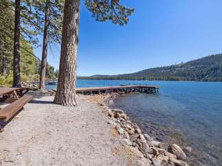 Enjoy lakeside living with this stunning property featuring a private dock perfect for swimming, boating, and soaking up the sun.