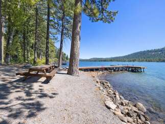 Enjoy lakeside living with this stunning property featuring a private dock perfect for swimming, boating, or simply soaking up the sun.