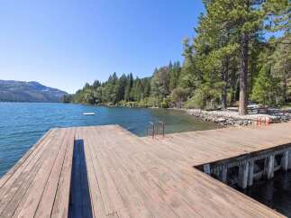 Enjoy direct lake access from this expansive private dock, perfect for swimming, boating, and soaking up the sun.