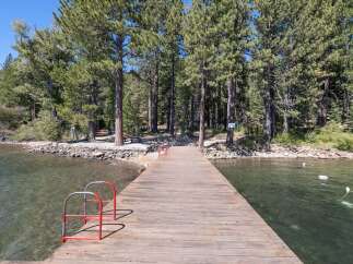 Enjoy direct lake access from this charming property featuring a private dock perfect for swimming, boating, or simply soaking up the sun.