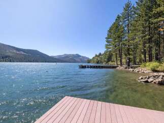 Enjoy breathtaking lakefront living with this stunning property featuring a private dock perfect for your boat or water activities.