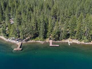 Experience lakeside living with this stunning property featuring multiple docks perfect for your boats and water toys.