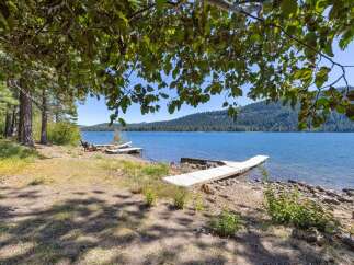 Enjoy direct lake access from this stunning property featuring a private dock perfect for your boat or water activities.
