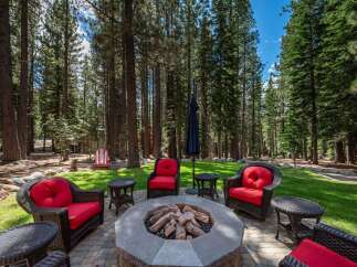 Experience outdoor living at its finest with this inviting patio space, perfect for gathering around the fire pit.