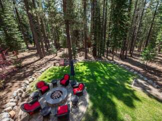 Experience outdoor living at its finest with this inviting backyard oasis, perfect for entertaining or relaxing evenings.