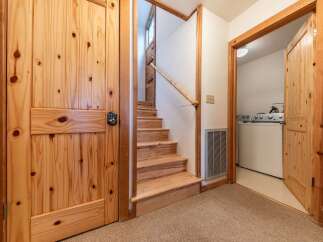 Discover rustic charm and modern convenience in this inviting entryway.