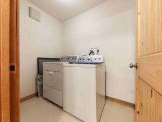 Discover convenience in this dedicated laundry room, featuring a washer and dryer set ready for your household needs.