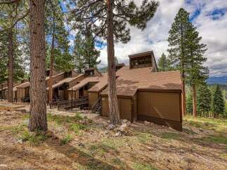 Nestled amidst tall pine trees, this multi-unit property offers a serene mountain retreat.