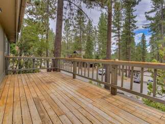 Enjoy the serene mountain lifestyle from this spacious wooden deck, perfect for outdoor living and entertaining.