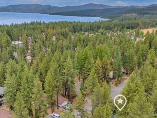 Nestled amidst a dense forest of mature pine trees, this property offers a serene and private retreat.