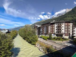 Experience mountain living in this stunning property featuring spacious balconies with breathtaking views of the Alps.