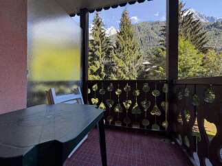 Enjoy breathtaking mountain views from this charming balcony, perfect for your morning coffee or evening relaxation.