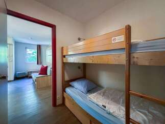 This cozy room features a space-saving bunk bed, perfect for families or groups.