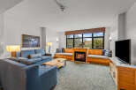 Experience cozy living in this inviting living room, featuring a beautiful fireplace as the centerpiece.