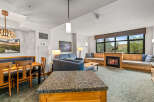 Experience cozy living in this spacious suite featuring a charming fireplace and ample seating.