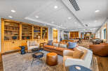 Experience ultimate relaxation in this inviting lounge area, featuring a plush leather sofa and comfortable armchairs perfect for unwinding.