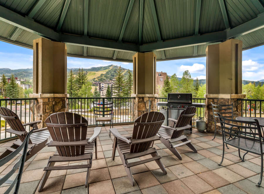 Enjoy breathtaking mountain views from this covered outdoor patio, perfect for entertaining or relaxing.