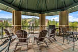 Enjoy breathtaking mountain views from this covered outdoor patio, perfect for entertaining or relaxing.