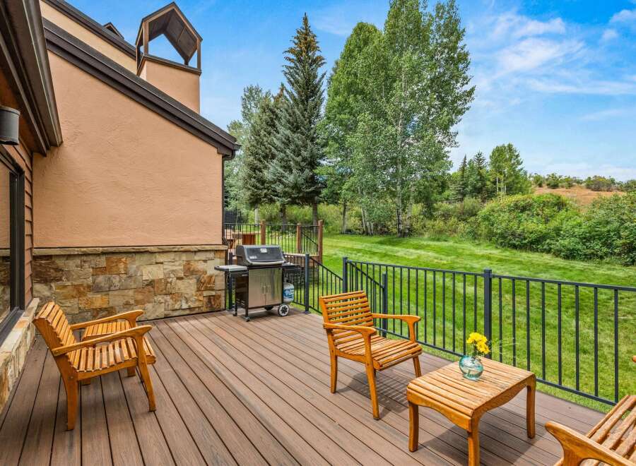 Enjoy outdoor living on this spacious deck, perfect for entertaining or relaxing.