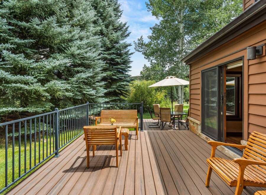 Enjoy the serene mountain setting from this spacious deck, perfect for outdoor entertaining or quiet relaxation.