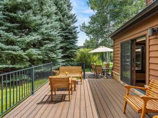 Enjoy the serene mountain setting from this spacious deck, perfect for outdoor entertaining or quiet relaxation.