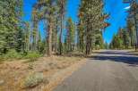 Nestled among towering pine trees, this property offers a serene and private setting.