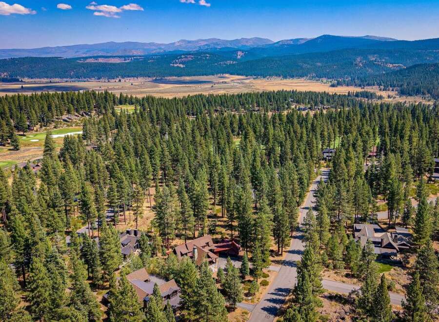 Nestled amidst a dense forest of mature pine trees, this property offers a serene and private retreat.