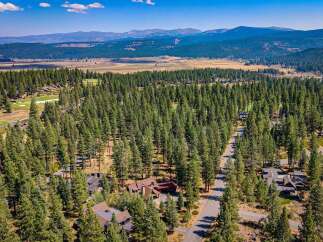 Nestled amidst a dense forest of mature pine trees, this property offers a serene and private retreat.