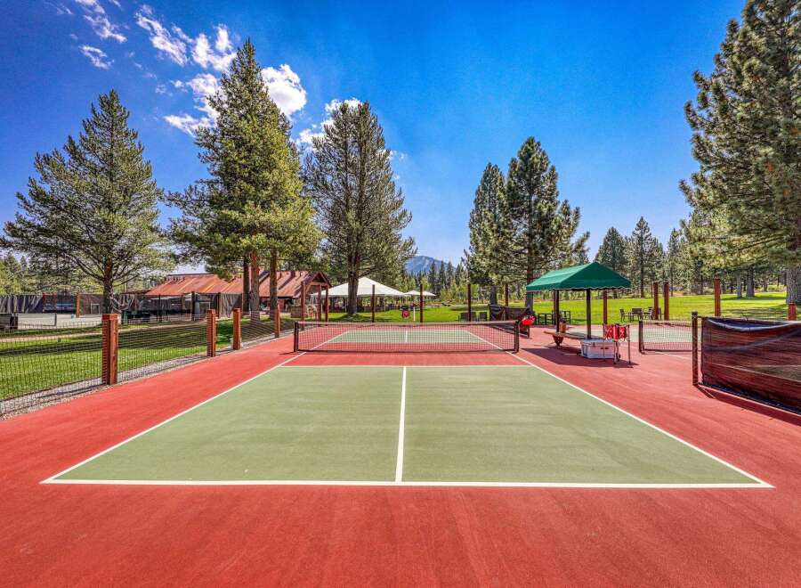 Enjoy outdoor recreation on this vibrant pickleball court, perfect for friendly matches and active living.