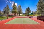 Enjoy outdoor recreation on this vibrant pickleball court, perfect for friendly matches and active living.