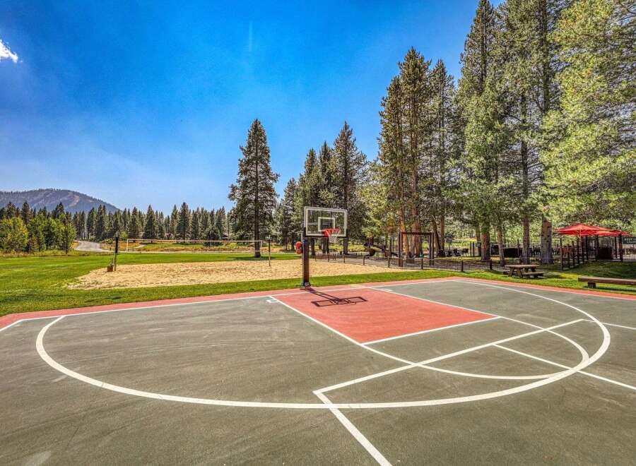 Enjoy outdoor recreation with a full-sized basketball court and a sand volleyball court, perfect for active living.