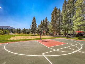 Enjoy outdoor recreation with a full-sized basketball court and a sand volleyball court, perfect for active living.