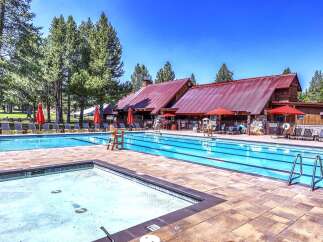 Enjoy a refreshing dip in this stunning resort-style swimming pool, complete with a separate shallow area perfect for relaxation.