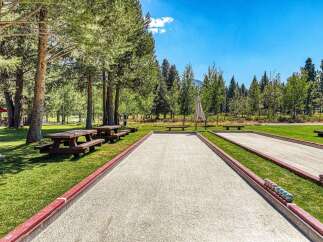 Enjoy outdoor recreation with multiple bocce ball courts and picnic areas set amidst a scenic park-like setting.