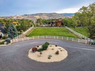 Discover this stunning property featuring a modern home with expansive green spaces, perfect for outdoor living and entertaining.