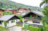 Nestled in a picturesque mountain village, this charming property offers a serene escape with its traditional alpine architecture.