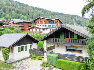 Nestled in a picturesque mountain village, this charming property offers a serene escape with its traditional alpine architecture.