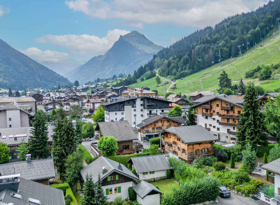 Discover this charming alpine village nestled amidst breathtaking mountain scenery.
