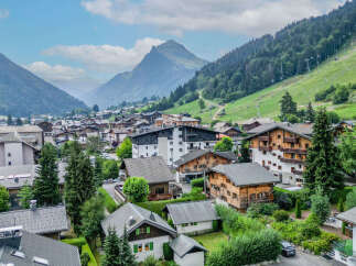 Discover this charming alpine village nestled amidst breathtaking mountain scenery.