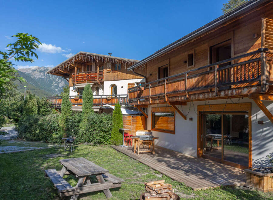 Experience alpine living in this charming wooden chalet, perfect for a mountain getaway.