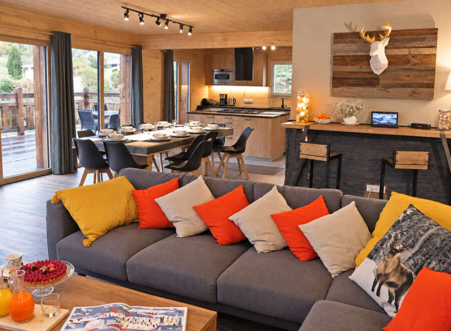 Experience luxury mountain living in this stunning chalet, featuring an open-plan living, dining, and kitchen area perfect for entertaining.