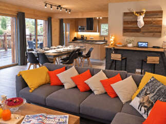 Experience luxury mountain living in this stunning chalet, featuring an open-plan living, dining, and kitchen area perfect for entertaining.