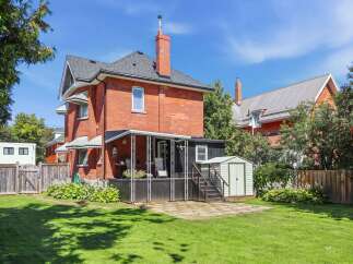 Discover this charming brick home with a spacious backyard, perfect for outdoor entertaining.