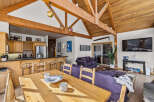 Experience the perfect blend of rustic charm and modern comfort in this spacious open-concept living area.