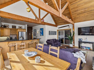 Experience the perfect blend of rustic charm and modern comfort in this spacious open-concept living area.