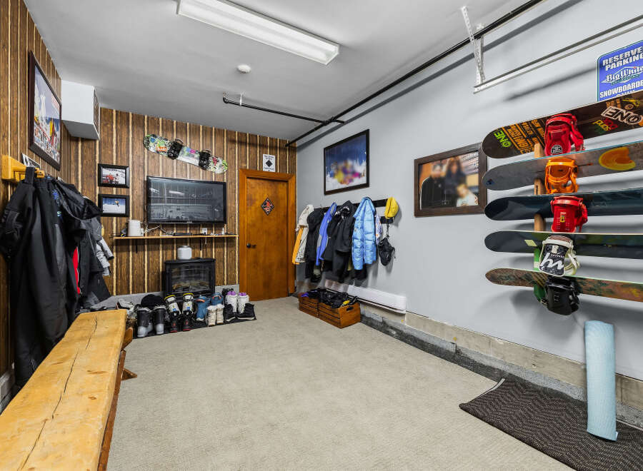 Gear up for your next adventure in this well-equipped ski and snowboard storage area.
